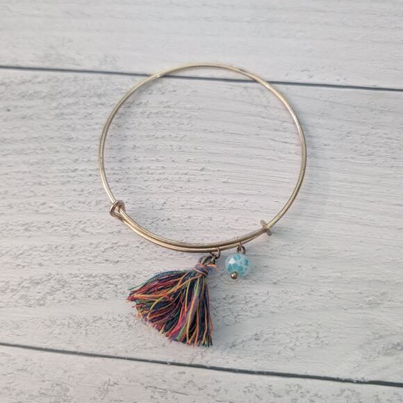 Gold Tone Adjustable Bracelet with Tassel Charm - Picture 1 of 6